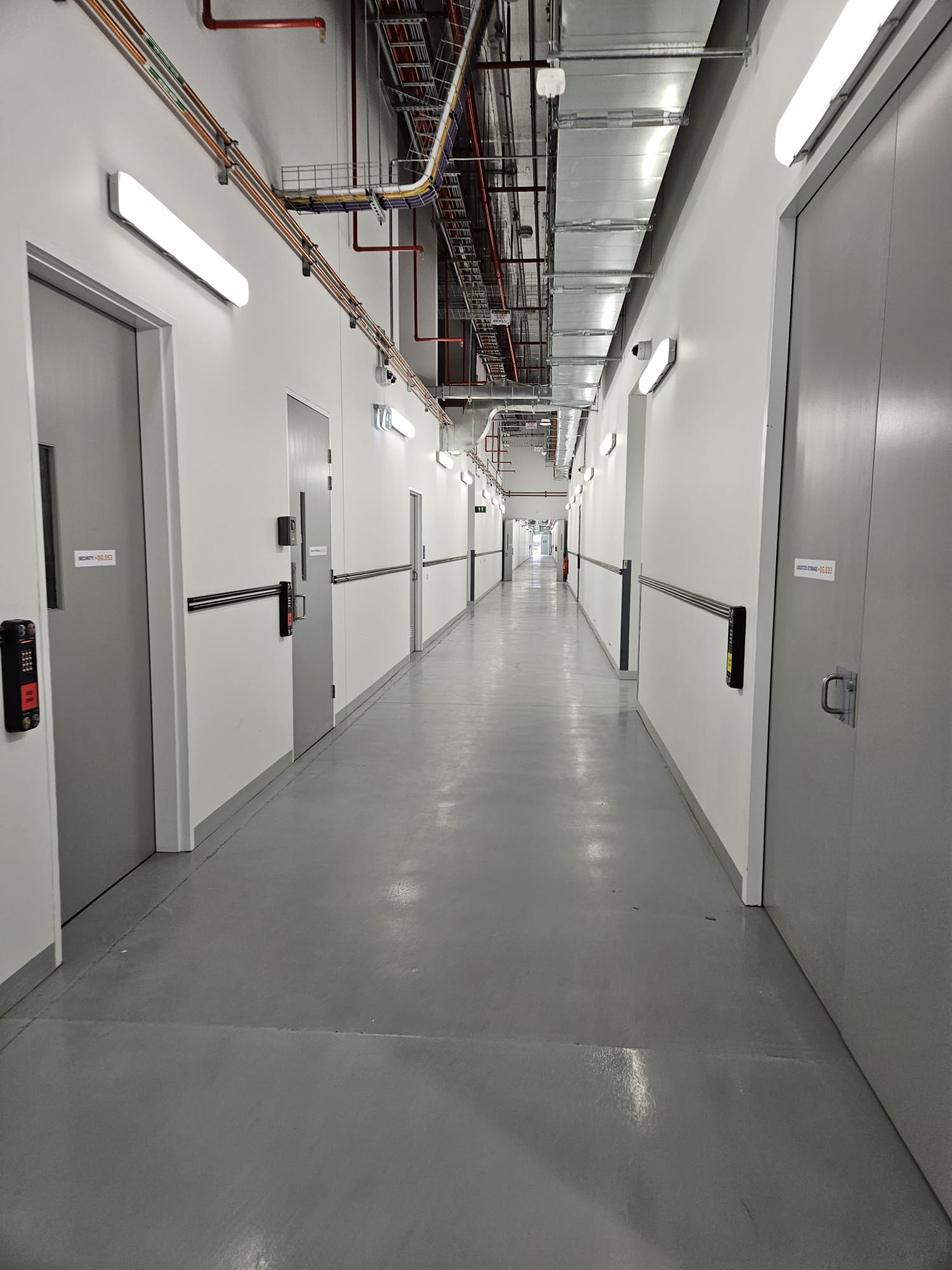 Altocon delivered industrial corridor with new services, lighting and polished floor